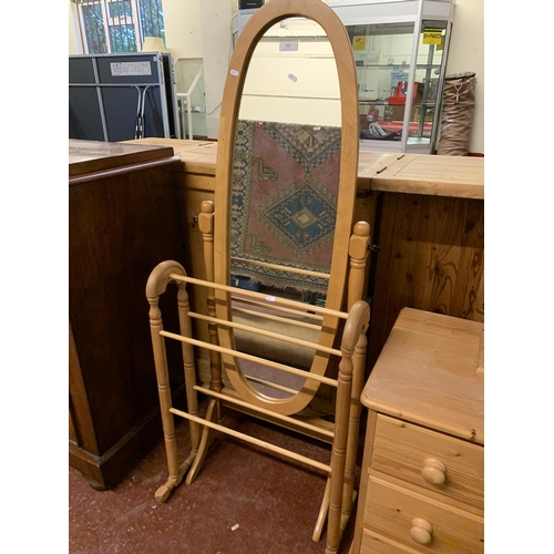 321 - A beech framed cheval mirror together with a pine towel rail in the Victorian style