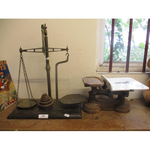 100 - A set of vintage balance scales and weights together with a set of vintage grocer's scales
