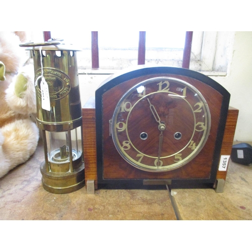 102 - A Welsh miner's safety lamp together with an oak cased mantle clock