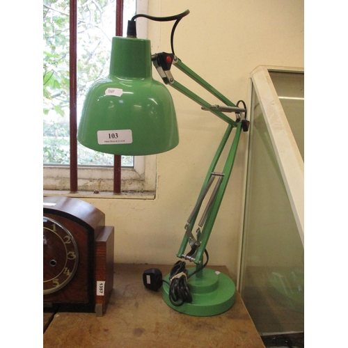 103 - An angle poise desk lamp finished in green