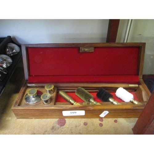 109 - A 12 gauge shotgun cleaning kit contained within a fitted box