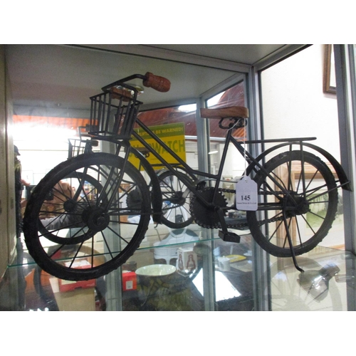 145 - A metallic model of a vintage bicycle