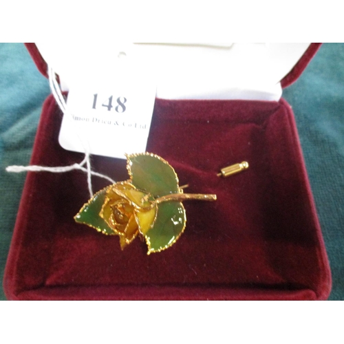 148 - A Leaves of Gold enamelled and gilded brooch modelled in the form of a rose