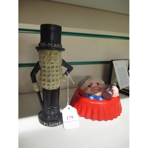 179 - Two cast iron money boxes, one modelled as Mr. Peanut and the other a Coca Cola bottle lid