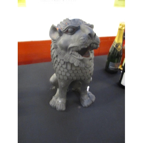 241 - A painted terracotta of a seated oriental dog