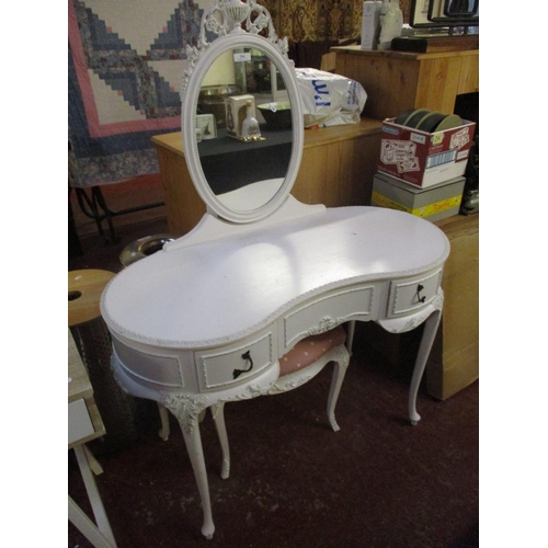 254 - A kidney shaped dressing table and stool in the Maria Antoinette style