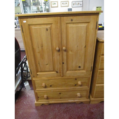 327 - A waxed pine cabinet fitted two long drawers below