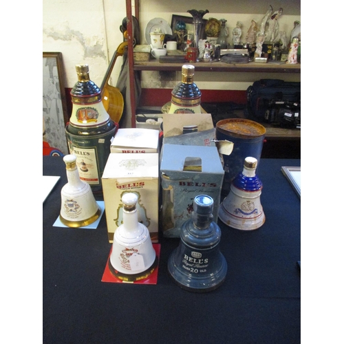 357 - Six Bell's commemorative Whisky decanters