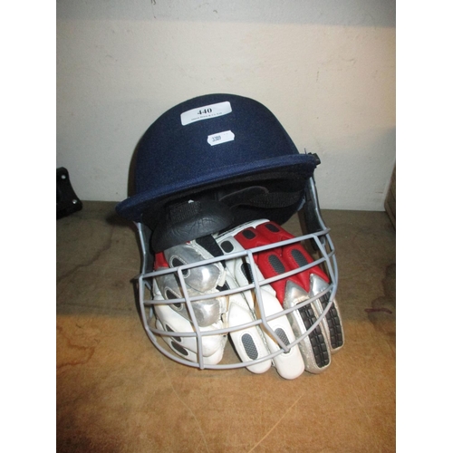 440 - A Slazenger batsman helmet and gloves