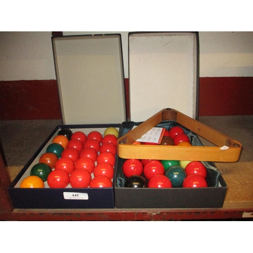 445 - Two sets of snooker balls together with a snooker triangle