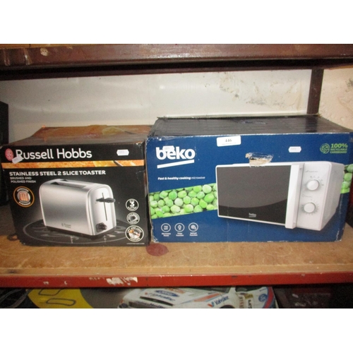 446 - A beko 700 watt microwave oven together with a Russell Hobbs stainless steel two slice toaster - new... 