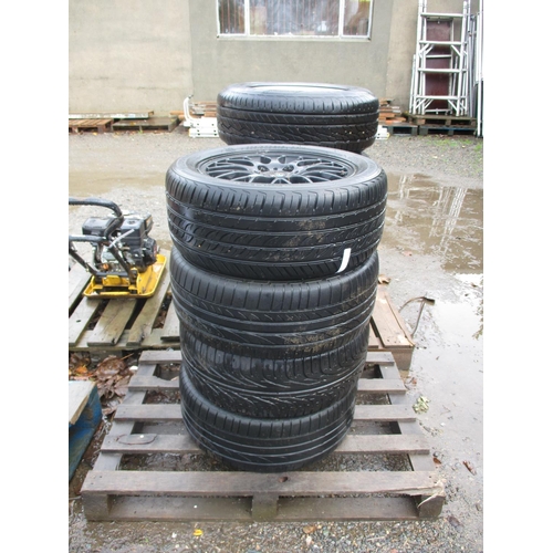 62 - A set of four BMW black aluminium wheels and tyres (225/50ZR16)