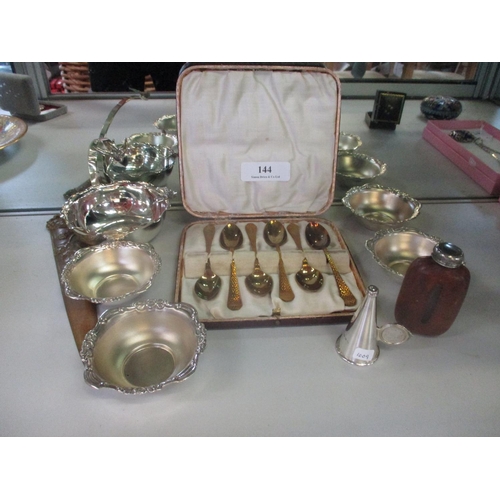 144 - A selection of objects d'art to include silver dishes, a silver candle snuffer and other items