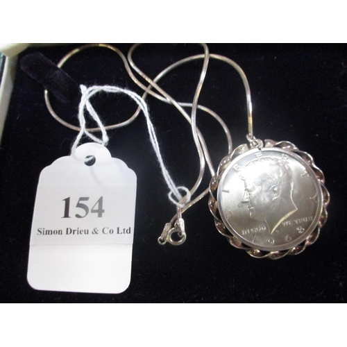 154 - A 1968 United States of America half dollar now mounted as a pendant and suspended on a chain