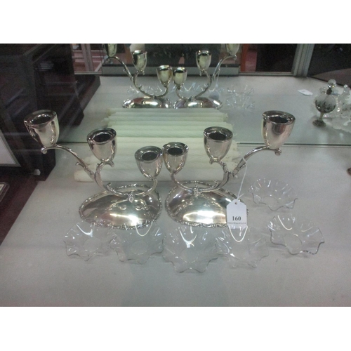 160 - A pair of sterling silver three branch candelabra