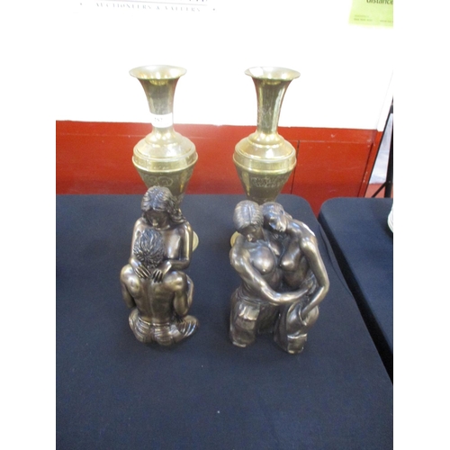 257 - A pair of group models depicting the naked form together with a pair of brass vases in the oriental ... 