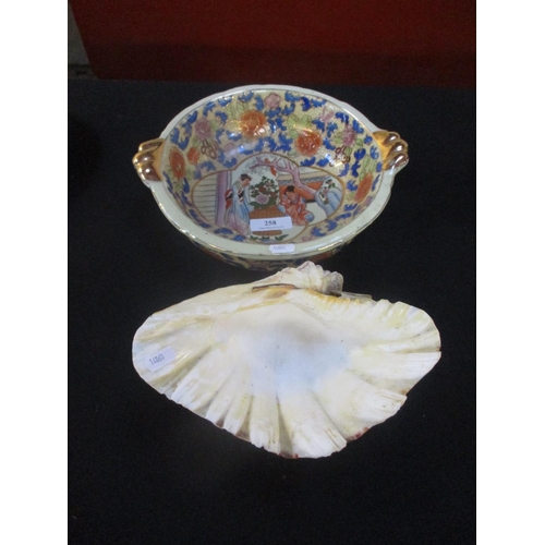 258 - A bowl with gilded floral and figural decoration in the oriental style together with a conch shell n... 