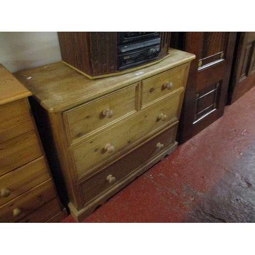 447 - A waxed pine chest of two short over two long drawers