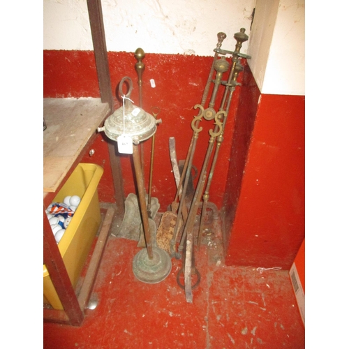 467 - Assorted brass fire irons and associated items