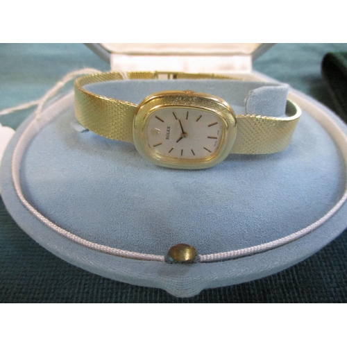 121 - A lady's vintage Rolex wrist watch in 18 carat yellow gold complete with box and original guarantee