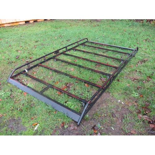 16 - A Rhino commercial vehicle roof rack complete with rear roller