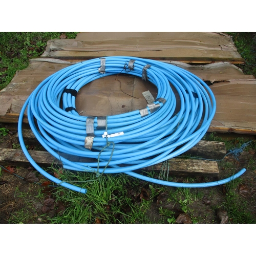 19 - Three coils of blue plastic water pipe