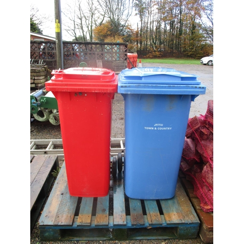 30 - A blue wheelie bin together with a red wheelie bin