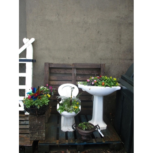 53 - A cloakroom suite now modelled as a garden display, two hanging baskets and other garden features