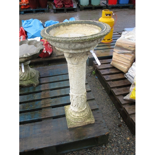 63 - A reconstituted stone bird bath the column modelled in the form of a Corinthian pillar