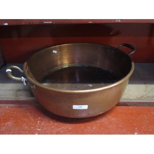 106 - A nineteenth century copper and brass handled preserving pan of large proportion