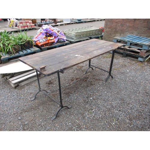 19 - A vintage trestle table fitted a blacksmith's vice of diminutive form