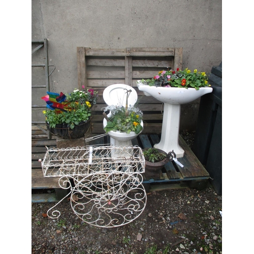 33 - A cloakroom suite now modelled as a garden display, two hanging baskets and other garden features