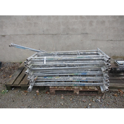 36 - A quantity of galvanised scaffold tower sections and associated accessories