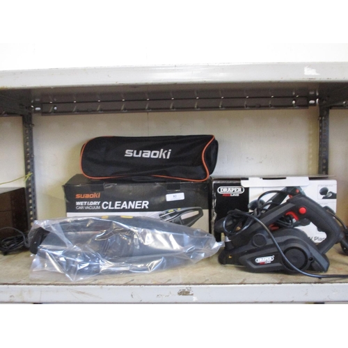 82 - A Suaoki wet and dry car vacuum cleaner together with a Draper Redline 600 watt planer - both unused