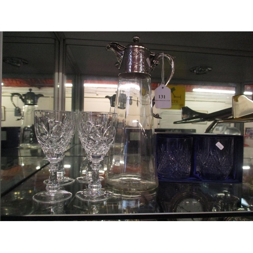 131 - A claret jug with silver plated mounts, a pair of whisky tumblers and a set of four wine glasses