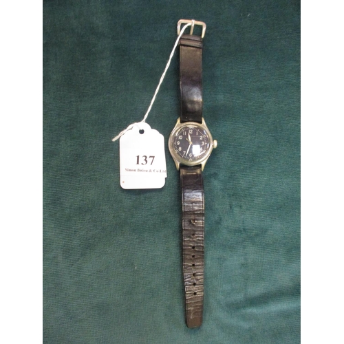 137 - A Bulova World War II military wrist watch with broad arrow insignia to verso