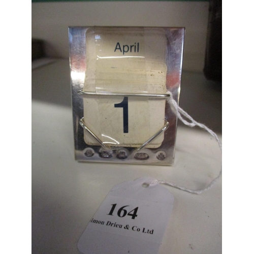 164 - A silver desk calendar