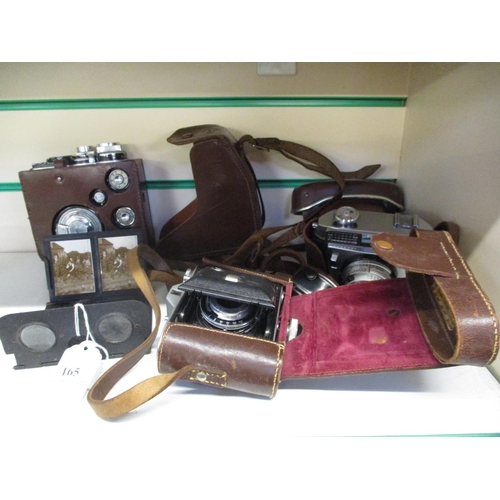 165 - A vintage photographic slide viewer together with three vintage cameras