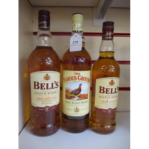 279 - Two bottles of Bell's Scotch Whisky together with a bottle of Famous Grouse Scotch Whisky