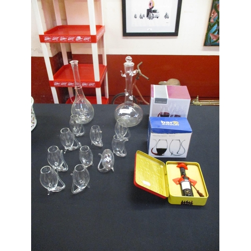 301 - A range of glass Port sippers, two decanters and a miniature bottle of Port