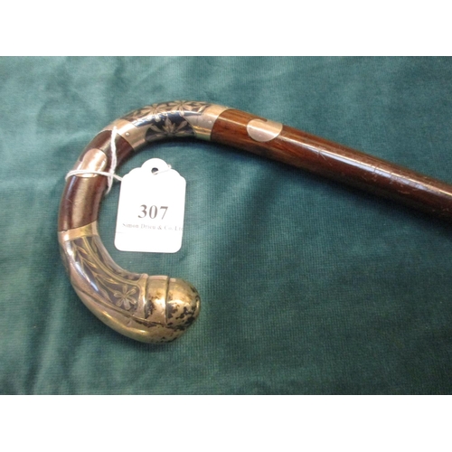 307 - A gentleman's walking cane with silver mounts