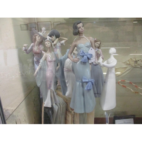 343 - Seven Lladro figures of women together with a Royal Doulton figure entitled 