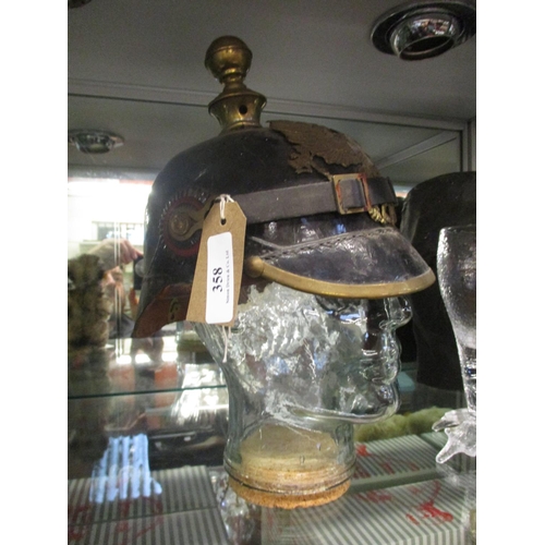 358 - A German World War I helmet (bust not included)