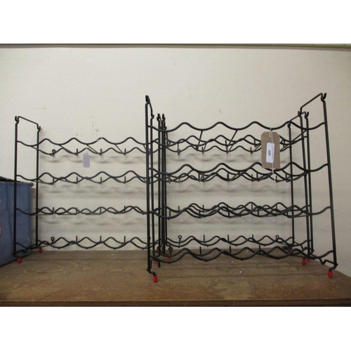 409 - Three black metallic wine racks