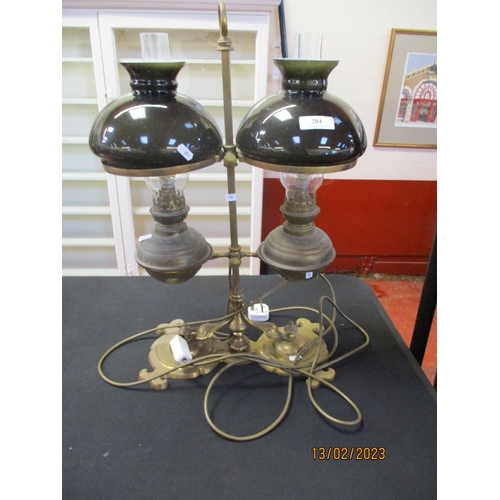 284 - A brass double adjustable table lamp modelled in the form of a pair of paraffin oil lamps