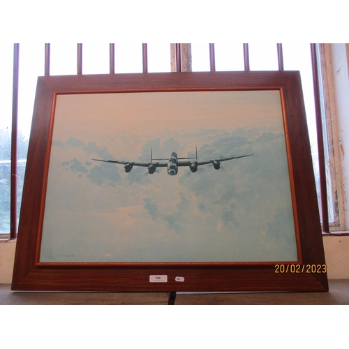 286 - A framed print of a Lancaster Bomber by Coulson