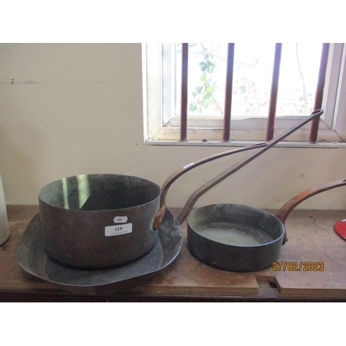 119 - Three vintage copper saucepans with cast iron handles