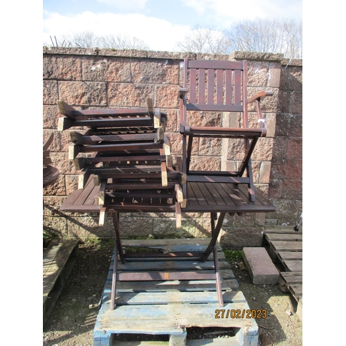 39 - A teak patio table together with six matching folding chairs