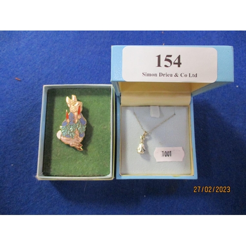 154 - A sterling silver Beatrix Potter Peter Rabbit pendant on chain together with an enamelled Peter Rabb... 