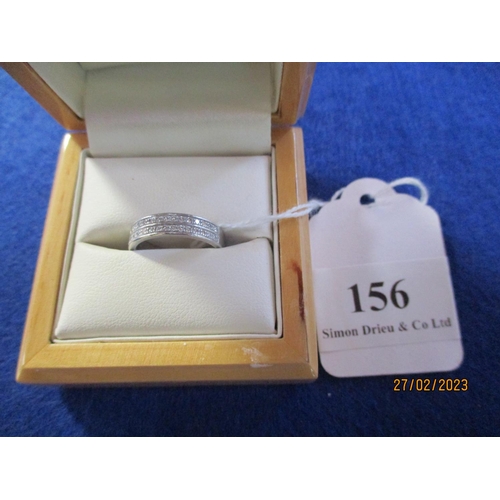 156 - A platinum wedding band set with multiple diamonds (size K) manufactured by Messrs. Aurum Jewellers